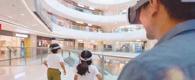 Players sharing a mixed reality game in a real venue